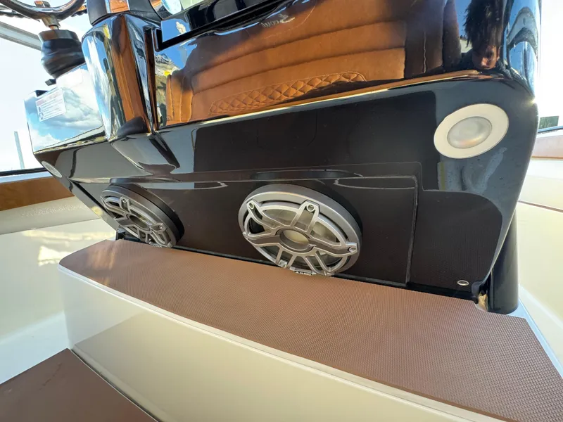 Slide: The Image of 2021 Scout 330 LXF boat speakers and console detail. - 62