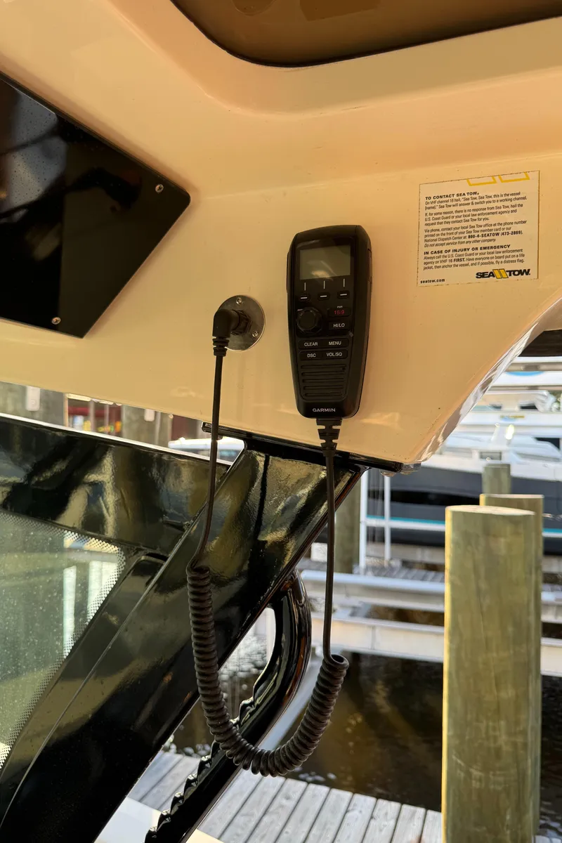 Slide: The Image of 2021 Scout 330 LXF boat with mounted Garmin marine radio. - 67