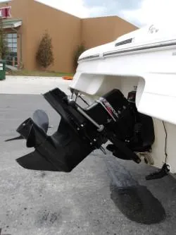 Slide: The Image of 2004 Mariah SK-10 boat with outboard motor, parked on pavement. - 4