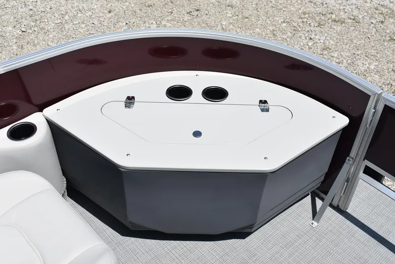 Slide: The Image of 2024 SunChaser Geneva 20 Fish 4 boat interior with storage compartment and cup holders. - 16