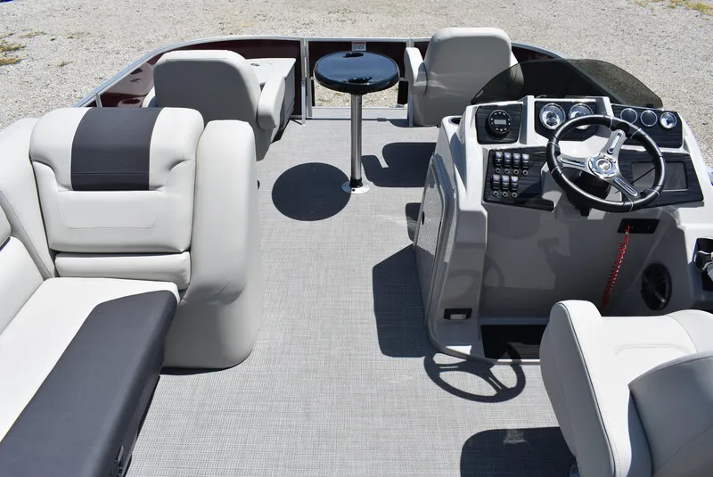 Slide: The Image of 2024 SunChaser Geneva 20 Fish 4 pontoon boat interior with helm and seating. - 2