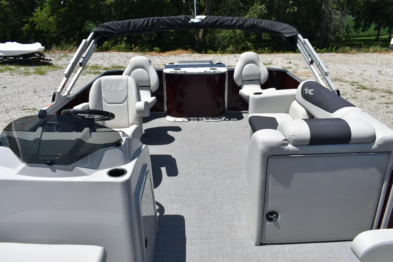 Slide: The Image of 2024 SunChaser Geneva 20 Fish 4 pontoon boat interior with seating and helm. - 3