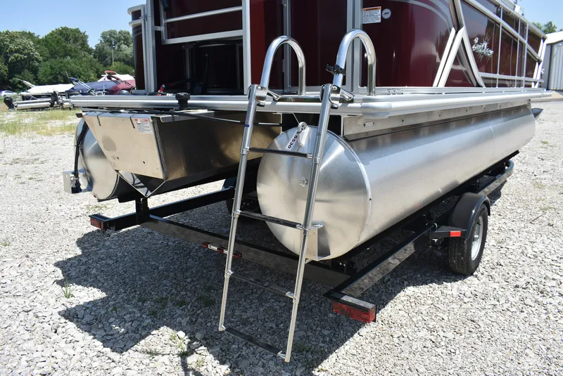 Slide: The Image of 2024 SunChaser Geneva 20 Fish 4 pontoon boat rear view with ladder and trailer. - 5