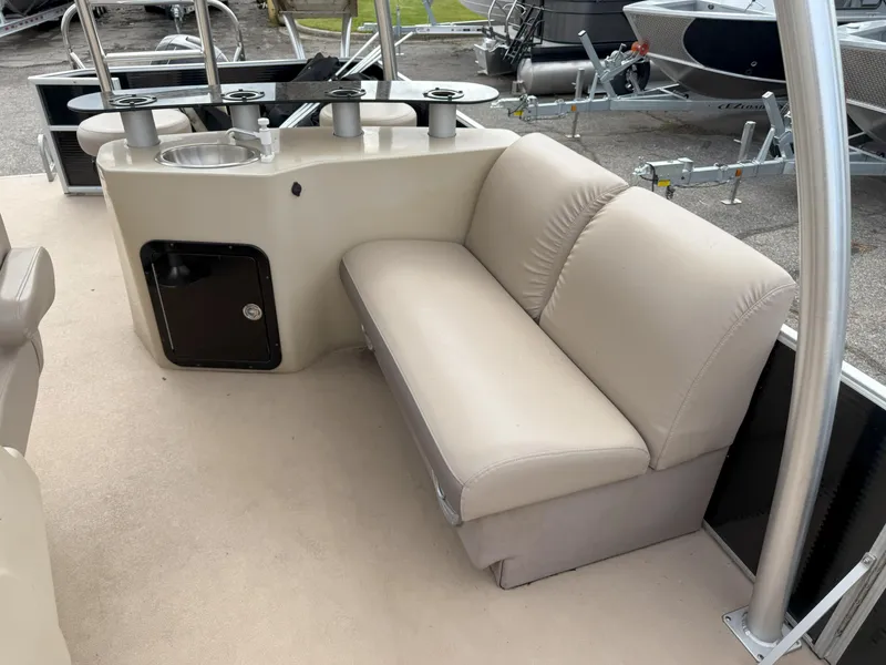 Slide: The Image of Luxurious seating area on a 2016 Sweetwater Premium Edition 240 SD pontoon boat. - 10