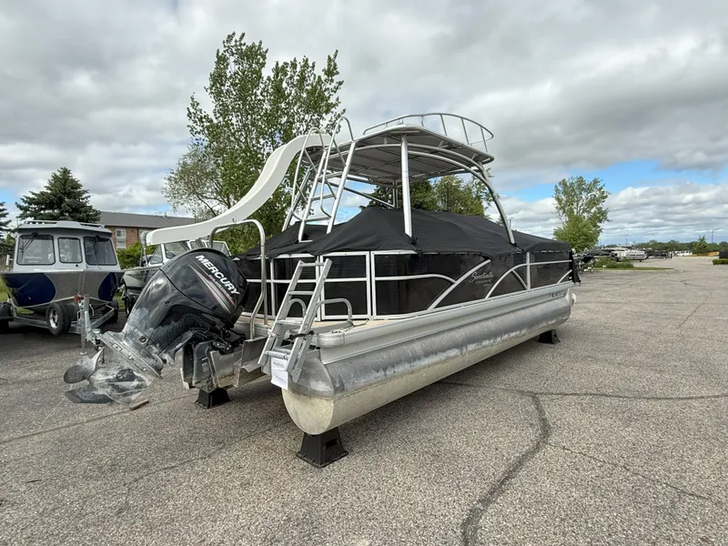 Slide: The Image of 2016 Sweetwater Premium Edition 240 SD pontoon boat with slide and Mercury outboard motor. - 3