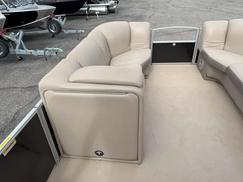 Slide: The Image of 2016 Sweetwater Premium Edition 240 SD boat interior with beige seating and spacious layout. - 8