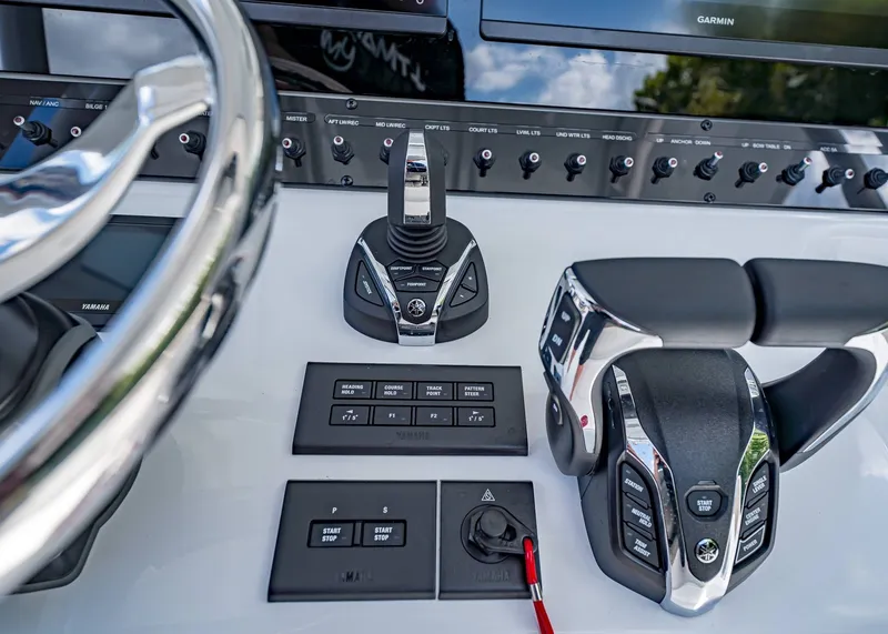Slide: The Image of Control panel of 2026 Sea Hunt Ultra 305 SE boat with advanced navigation features. - 26