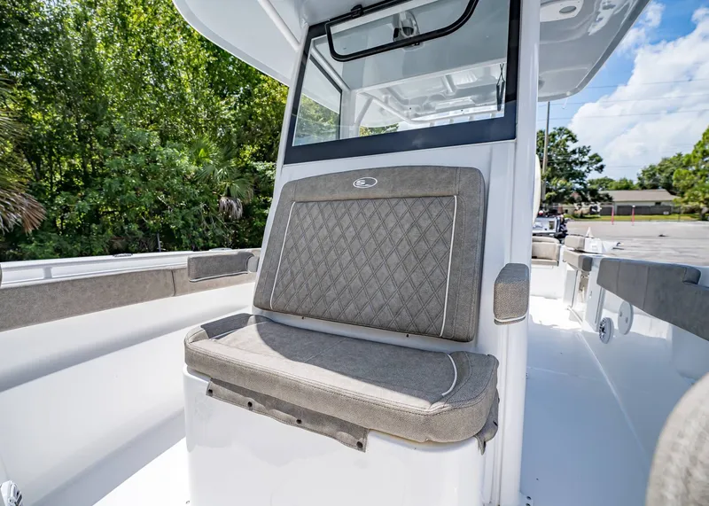 Slide: The Image of 2026 Sea Hunt Ultra 305 SE boat interior with cushioned seating and sleek design. - 34