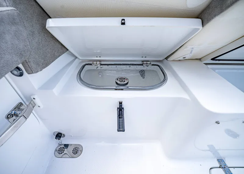 Slide: The Image of Interior storage compartment of 2026 Sea Hunt Ultra 305 SE boat. - 9