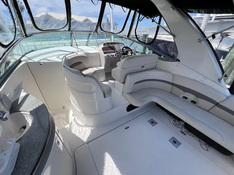 Slide: The Image of 2005 Chaparral Signature 350 boat interior with white seating and helm station. - 13