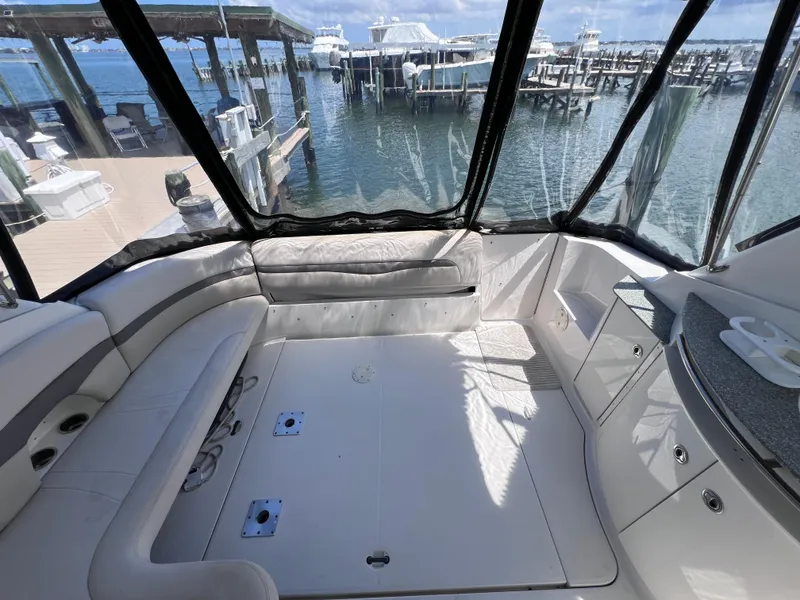 Slide: The Image of 2005 Chaparral Signature 350 boat interior with spacious seating and marina view. - 15