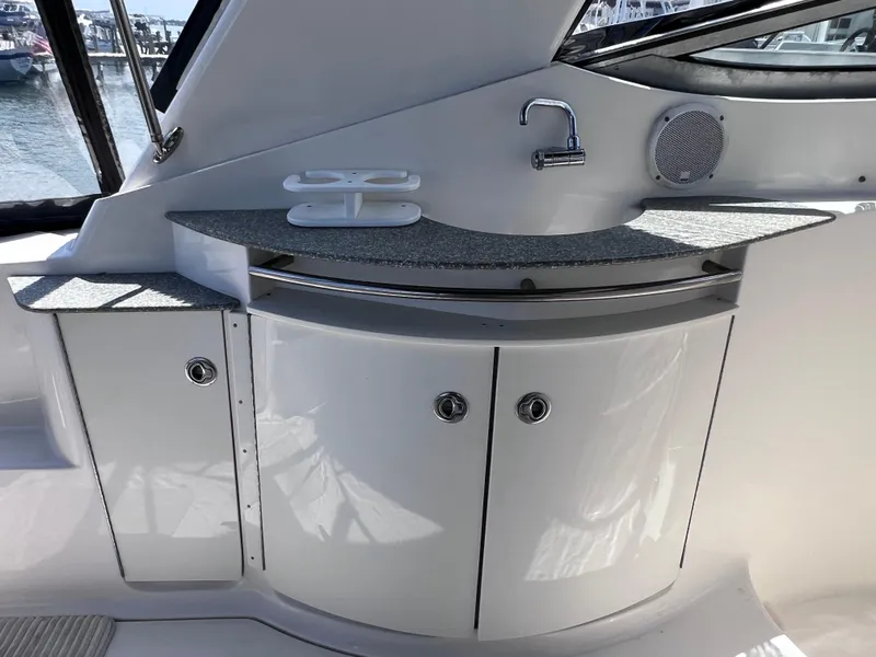 Slide: The Image of 2005 Chaparral Signature 350 yacht interior with sink, storage cabinets, and countertop. - 16