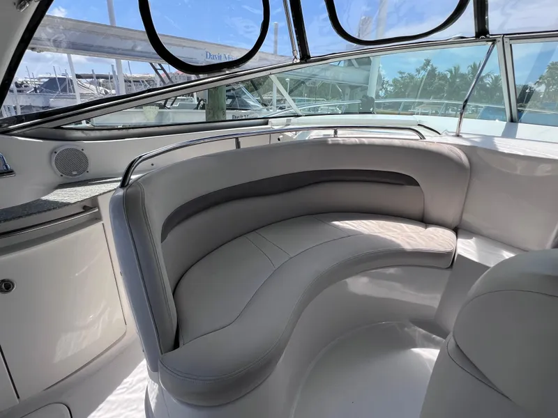 Slide: The Image of 2005 Chaparral Signature 350 boat interior with curved seating and large windows. - 20