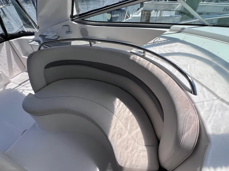 Slide: The Image of Curved seating area on 2005 Chaparral Signature 350 yacht, featuring sleek design and comfortable upholstery. - 26