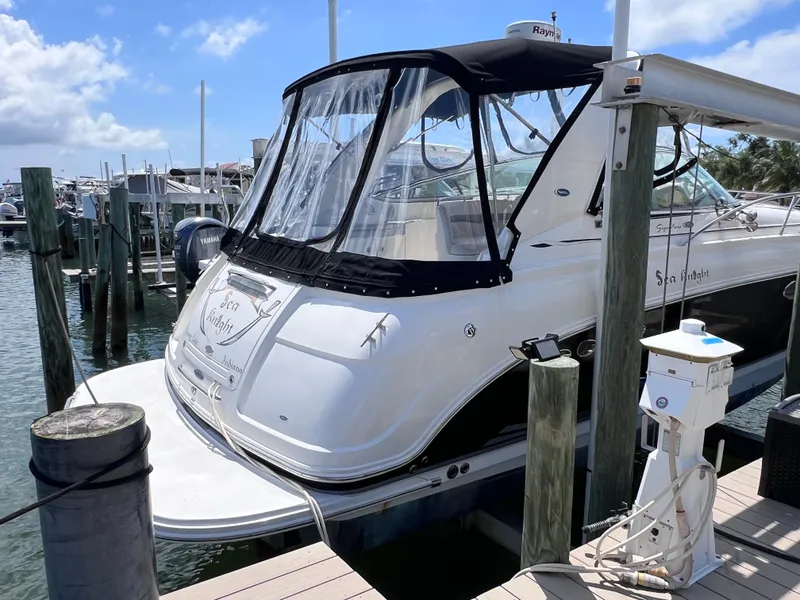 Slide: The Image of 2005 Chaparral Signature 350 boat docked at marina under clear blue sky. - 3