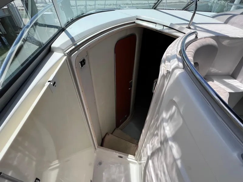 Slide: The Image of 2005 Chaparral Signature 350 cabin entrance with open door, showcasing interior access. - 31
