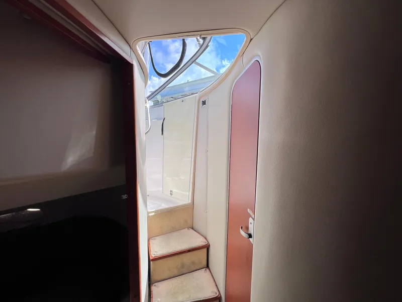 Slide: The Image of Interior view of 2005 Chaparral Signature 350 boat, showing stairs and cabin door. - 32