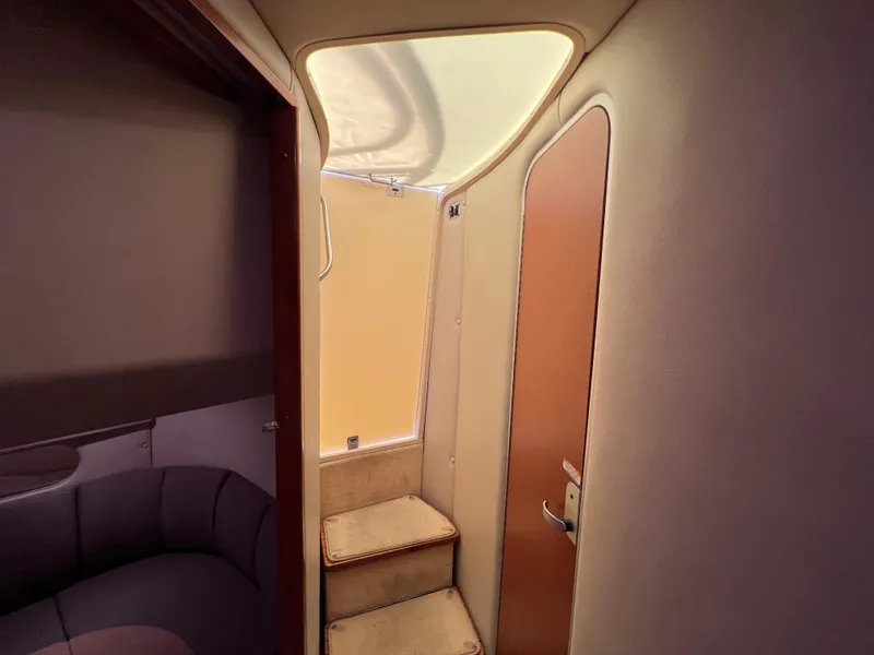 Slide: The Image of Interior of 2005 Chaparral Signature 350 yacht, featuring stairs and a door. - 33