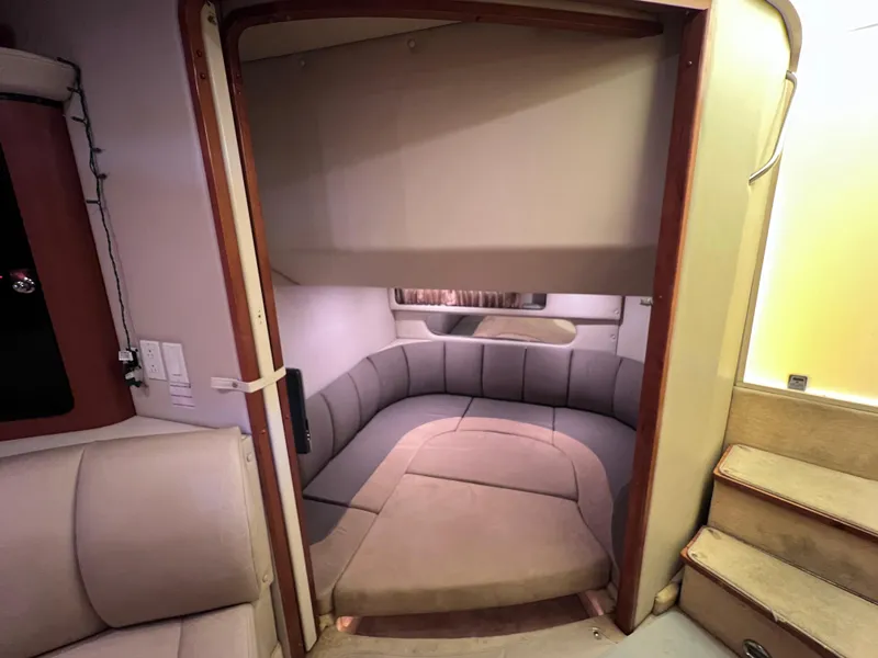 Slide: The Image of Interior cabin of 2005 Chaparral Signature 350 boat with cozy seating and soft lighting. - 35