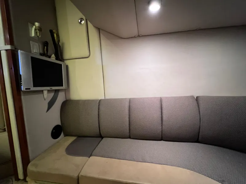 Slide: The Image of Interior of 2005 Chaparral Signature 350 with cozy seating and wall-mounted TV. - 37