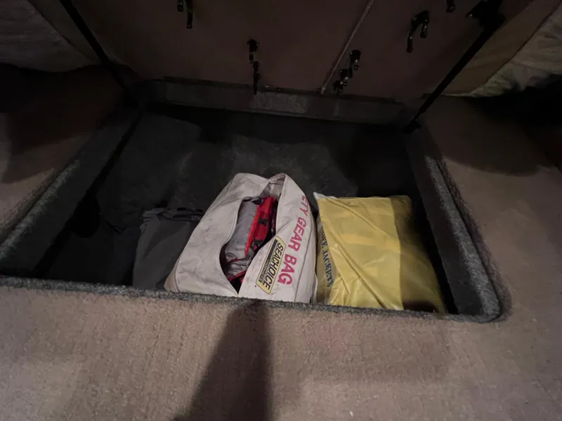 Slide: The Image of Under-seat storage in 2005 Chaparral Signature 350 with gear bags. - 48