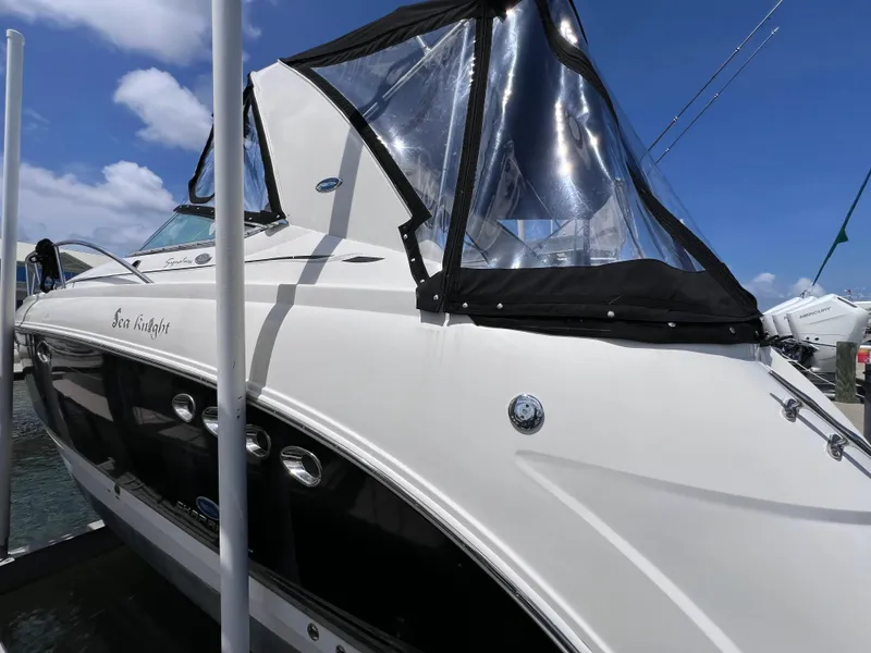 Slide: The Image of 2005 Chaparral Signature 350 boat docked under clear blue sky. - 6