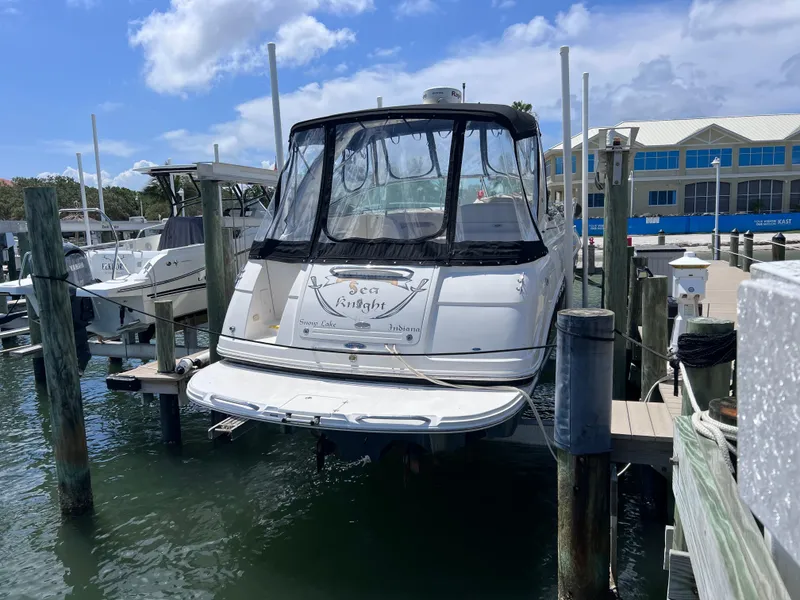 Slide: The Image of 2005 Chaparral Signature 350 boat docked at marina under blue sky. - 7