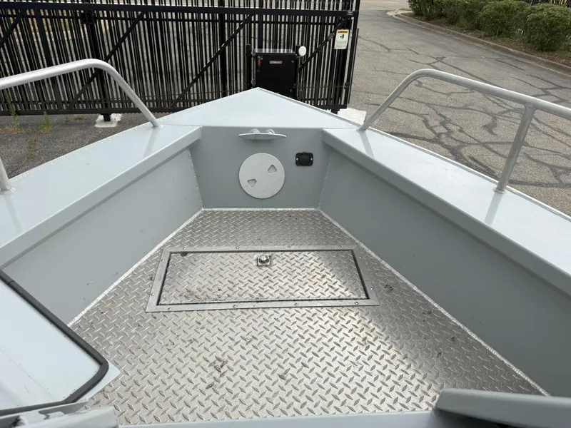 Slide: The Image of 2023 Hewescraft 240 Ocean Pro ET HT boat deck with diamond plate flooring. - 15