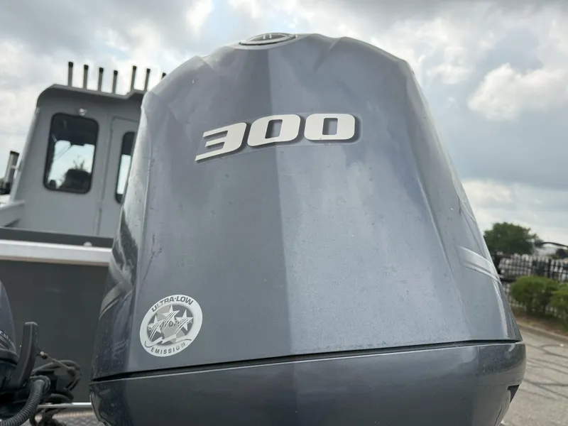 Slide: The Image of Outboard motor on 2023 Hewescraft 240 Ocean Pro ET HT boat, showcasing 300 horsepower. - 17
