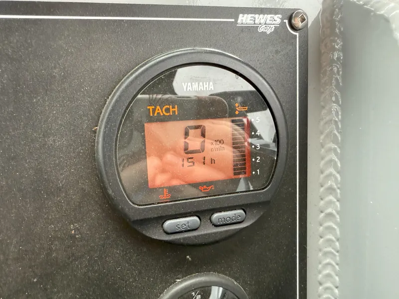 Slide: The Image of Tachometer display on 2023 Hewescraft 240 Ocean Pro ET HT boat dashboard. - 19