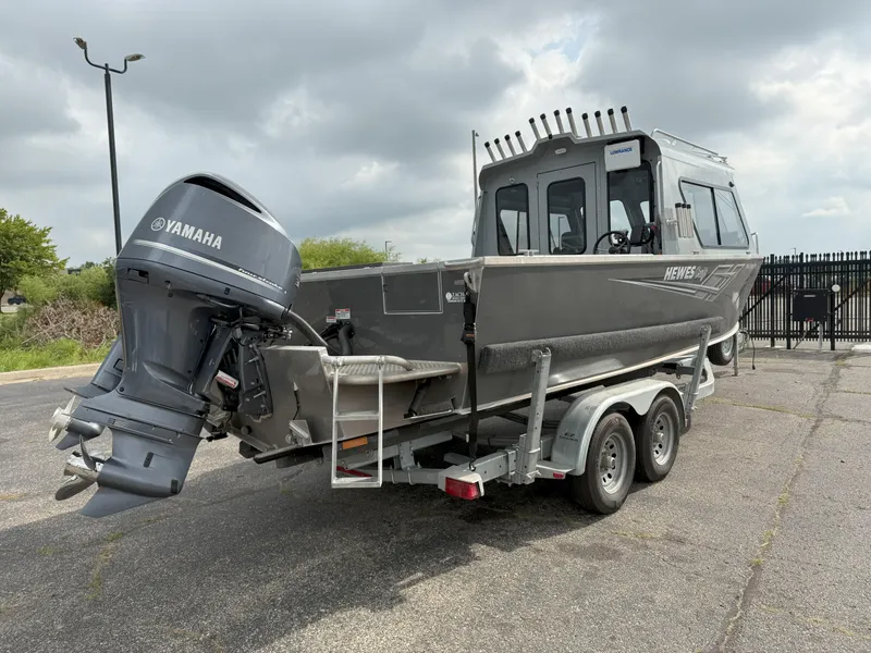 Slide: The Image of 2023 Hewescraft 240 Ocean Pro ET HT boat on trailer with Yamaha outboard motor. - 5
