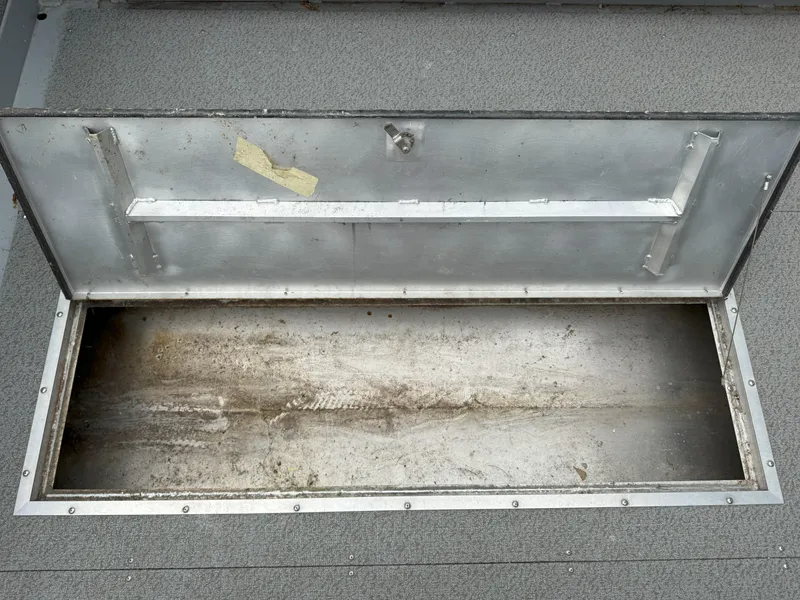 Slide: The Image of Open storage compartment on 2023 Hewescraft 240 Ocean Pro ET HT boat. - 7