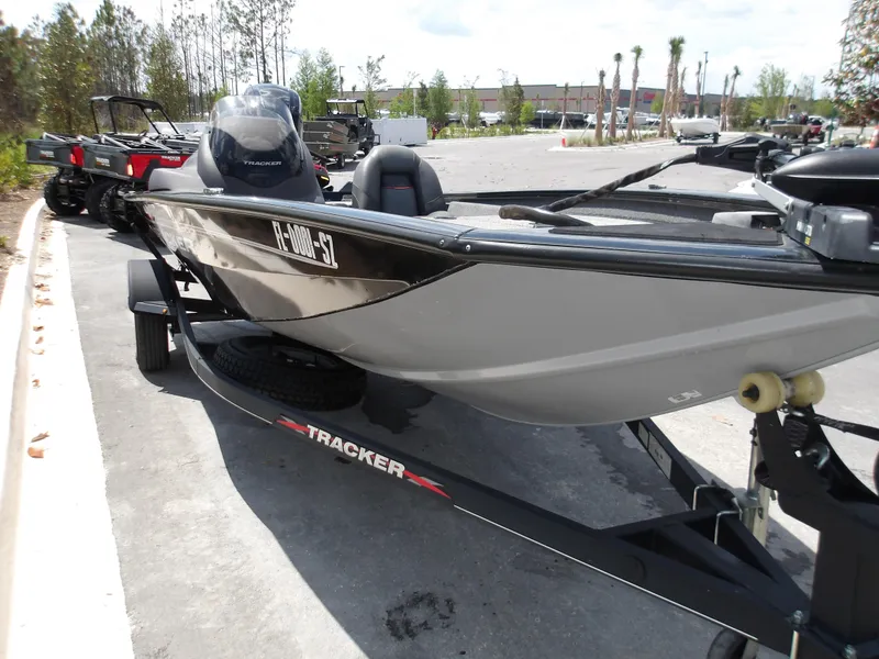 Slide: The Image of 2021 Tracker Pro Team 175 TXW boat on trailer in parking lot. - 8