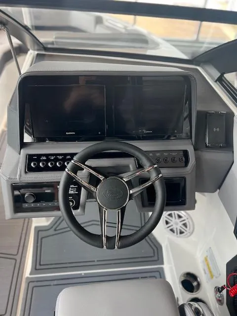 Slide: The Image of 2025 Cobalt R6 Surf dashboard with steering wheel and dual display screens. - 15