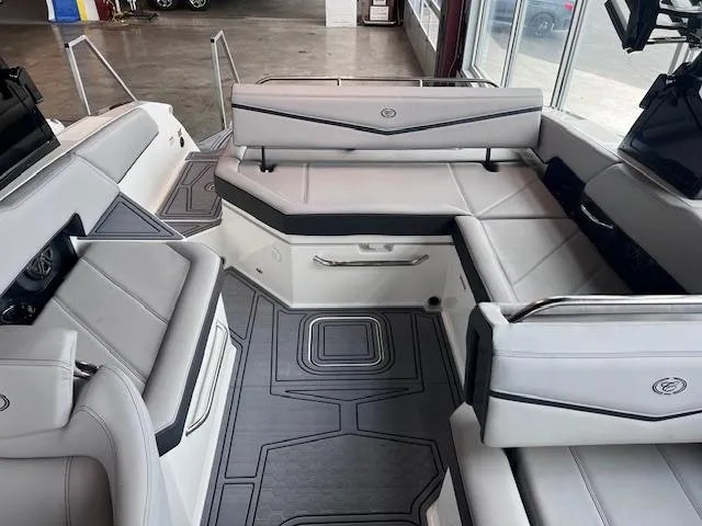 Slide: The Image of 2025 Cobalt R6 Surf boat interior with sleek gray seating and modern design. - 19