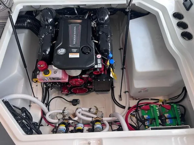Slide: The Image of Engine compartment of 2025 Cobalt R6 Surf boat, featuring Volvo Penta engine and battery setup. - 21