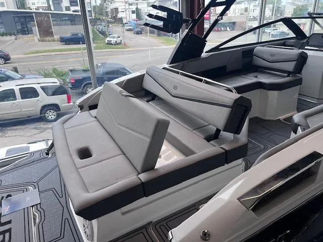 Slide: The Image of 2025 Cobalt R6 Surf boat interior with luxurious gray seating and modern design. - 26