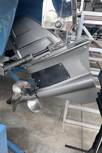 Slide: The Image of 2025 Cobalt R6 Surf boat motor with propeller in a workshop setting. - 29