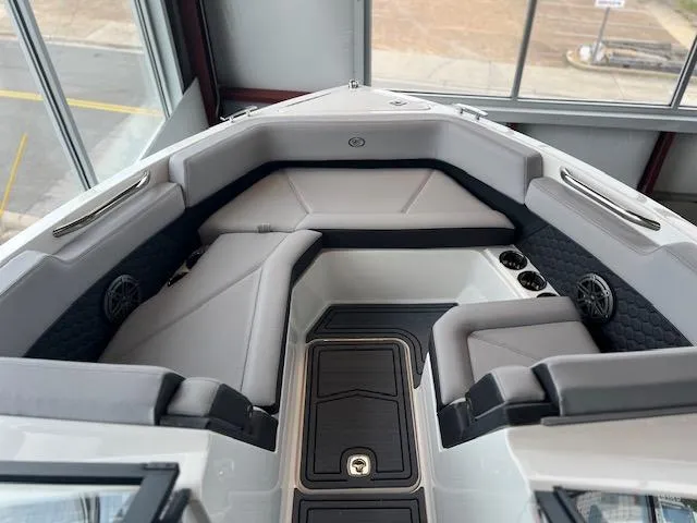 Slide: The Image of 2025 Cobalt R6 Surf boat interior with gray seating and modern design. - 5