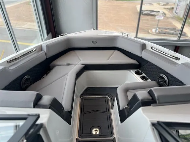 Slide: The Image of 2025 Cobalt R6 Surf boat interior with sleek seating and modern design. - 6