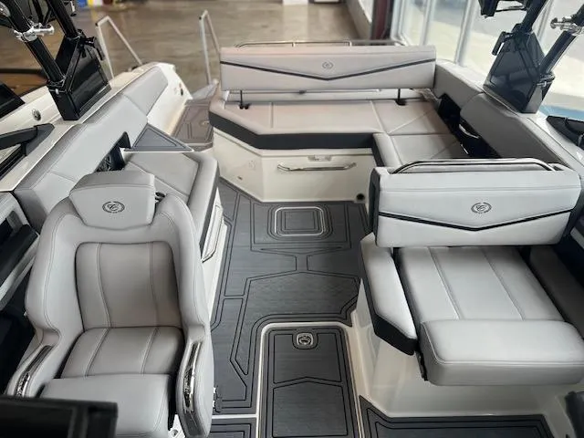 Slide: The Image of 2025 Cobalt R6 Surf boat interior with luxurious seating and modern design. - 7