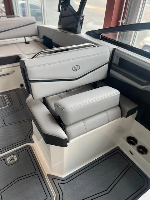 Slide: The Image of 2025 Cobalt R6 Surf boat interior with luxurious seating and modern design. - 9