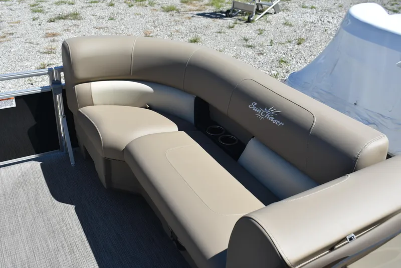 Slide: The Image of 2024 SunChaser Vista 20 Fish boat with beige seating and cup holders. - 15