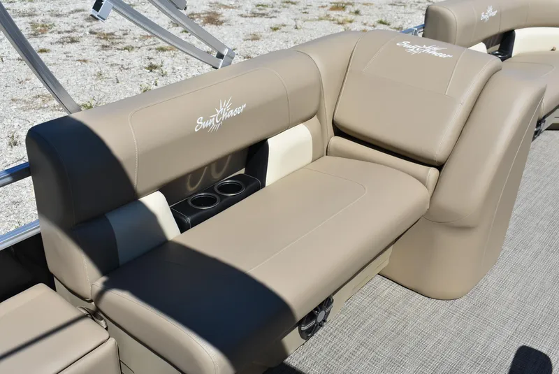 Slide: The Image of 2024 SunChaser Vista 20 Fish boat with beige seating and cup holders. - 16