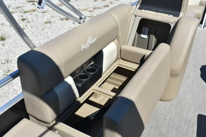 Slide: The Image of 2024 SunChaser Vista 20 Fish boat with open storage compartments and cup holders. - 17