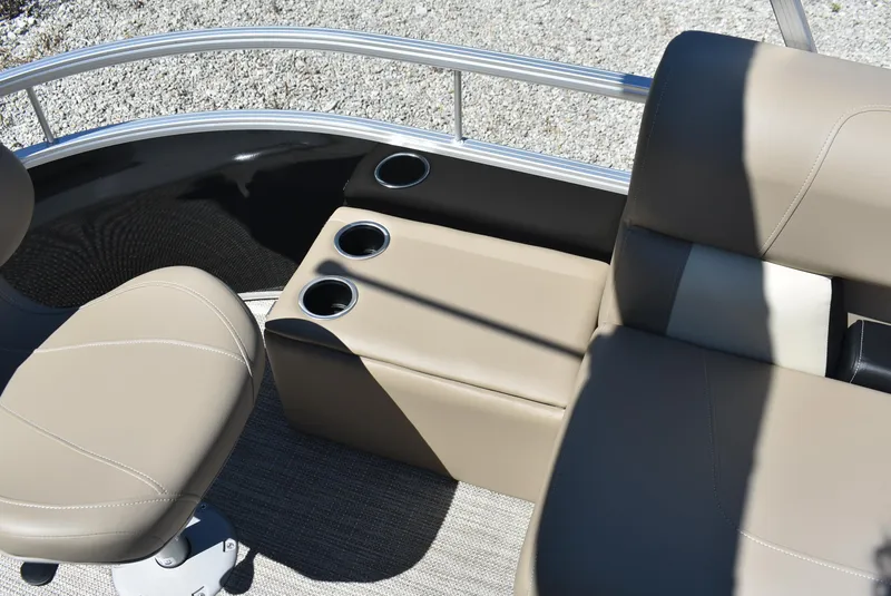 Slide: The Image of 2024 SunChaser Vista 20 Fish boat interior with beige seating and cup holders. - 5