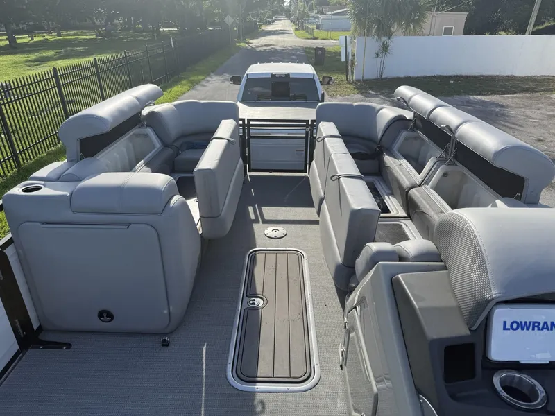 Slide: The Image of 2024 Regency 250 DL3 pontoon boat interior with spacious seating and modern design. - 10