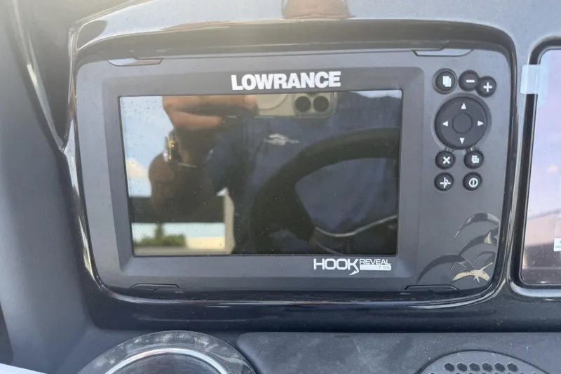 Slide: The Image of Lowrance Hook Reveal fish finder on 2024 Regency 250 DL3 boat dashboard. - 12