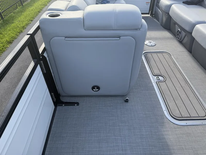 Slide: The Image of 2024 Regency 250 DL3 boat interior with gray seating and flooring. - 24