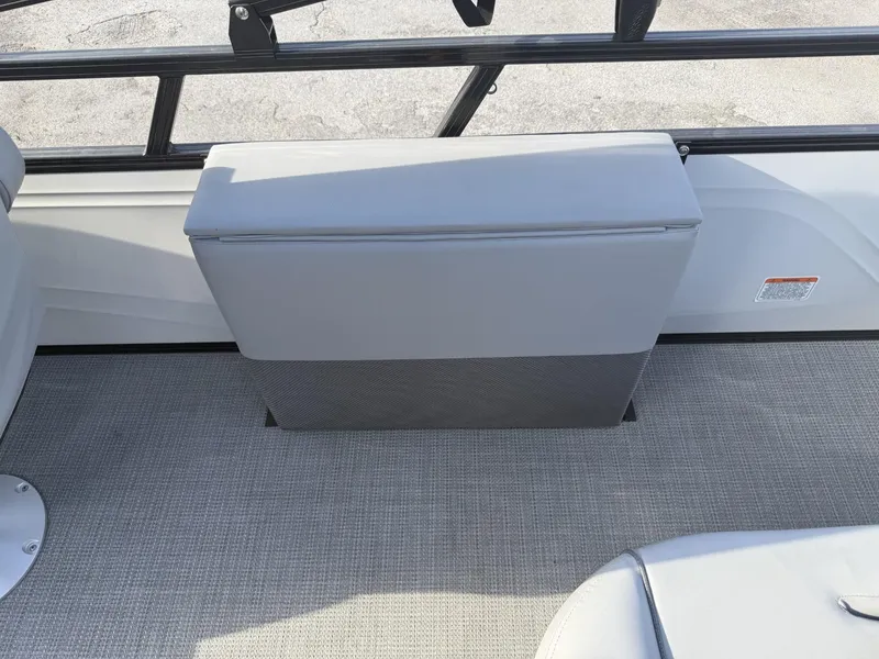 Slide: The Image of 2024 Regency 250 DL3 boat interior with gray seating and textured flooring. - 27